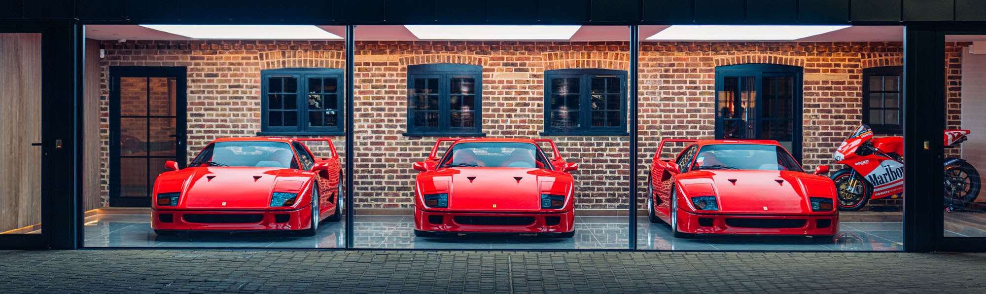 Three Ferrari F40s in DK Engineerings showroom